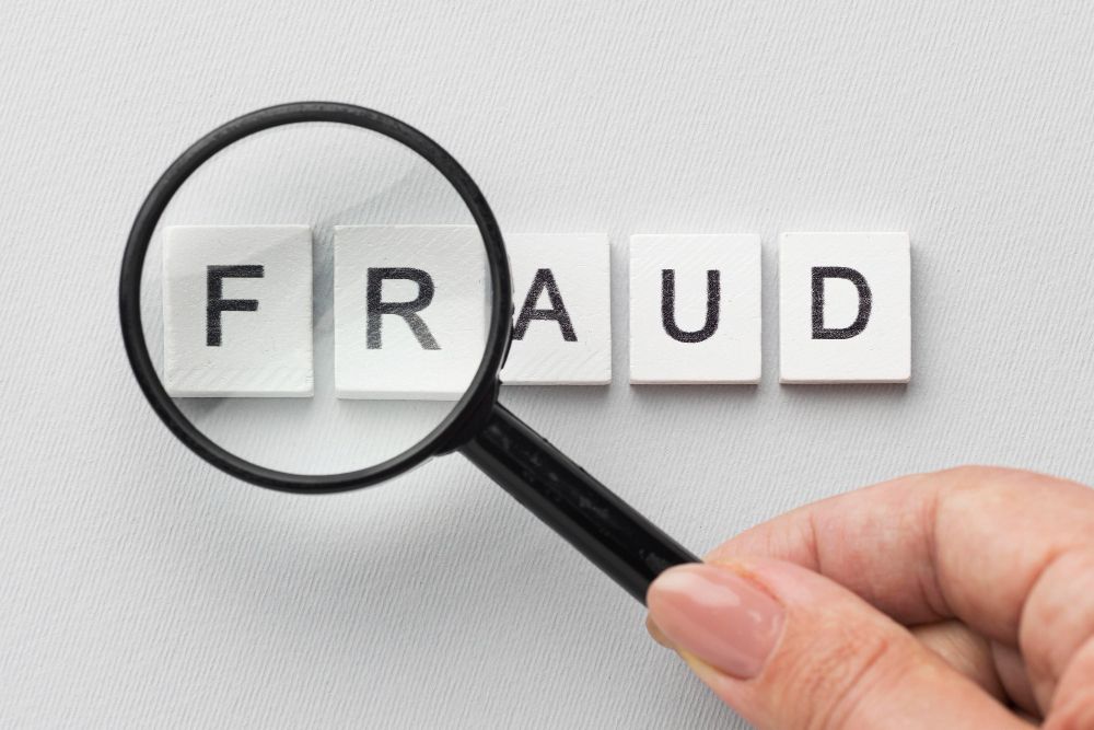 Fraud word magnifying glass